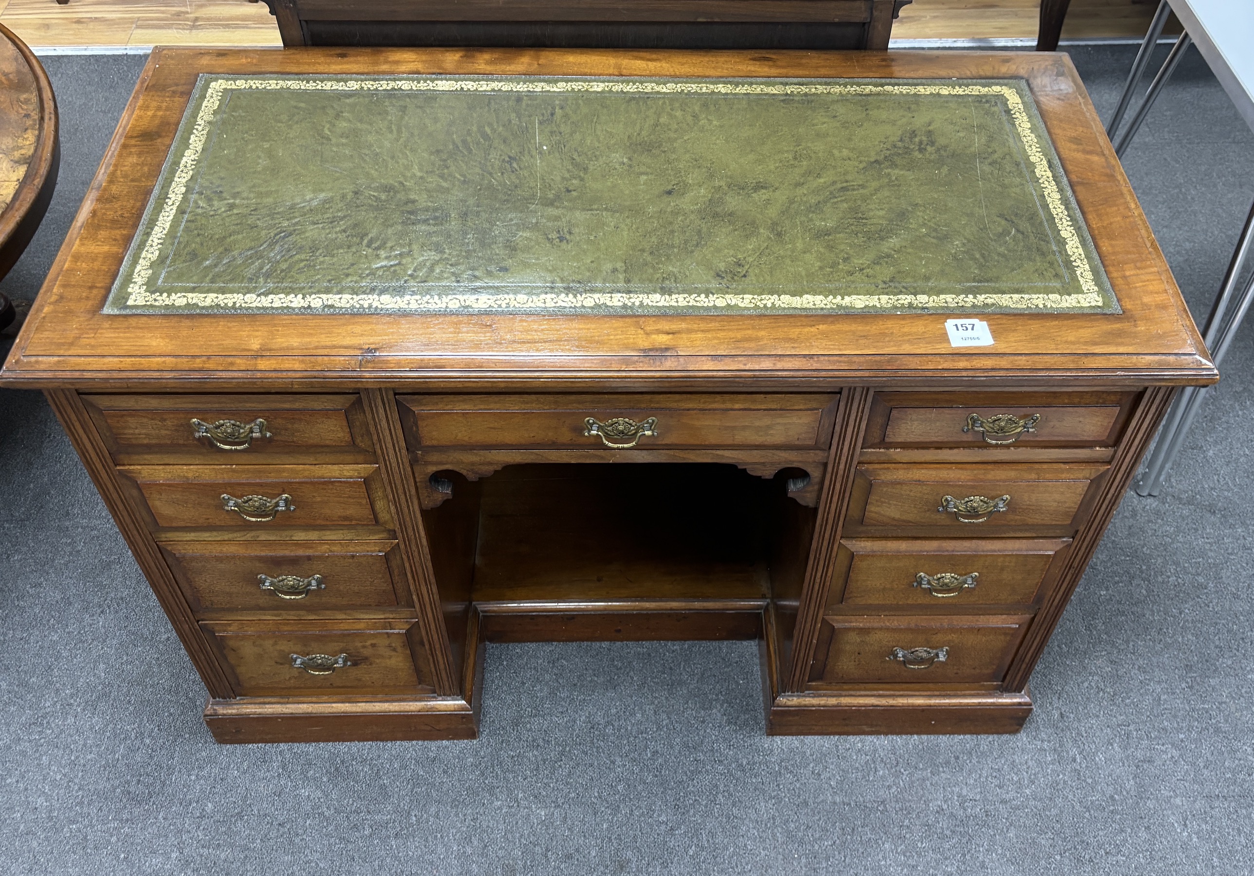 A late Victorian walnut kneehole desk, width 114cm, depth 56cm, height 76cm